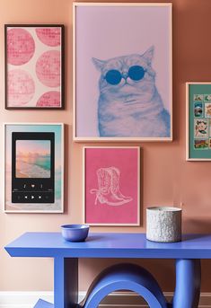 a blue table with pictures on the wall