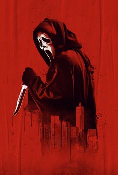 a man in a hoodie holding a knife and wearing a mask over his face