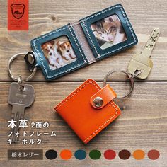 an orange leather keychain with two pictures on it and a cat in the center