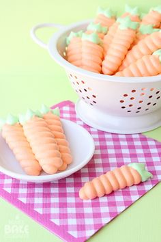 there are carrots that have been cut into small pieces in the bowl on the table