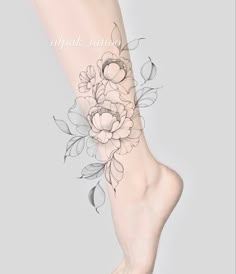 a woman's foot with flowers on it and the words, apak tattoo