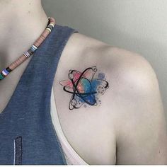 a woman with a colorful tattoo on her shoulder