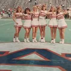 a group of women standing on top of a basketball court