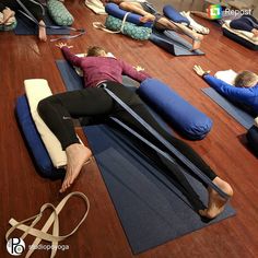 a group of people doing yoga on mats