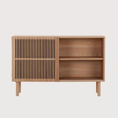 the sideboard is made out of wood and has two open compartments on each side