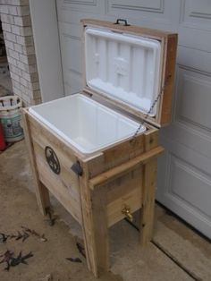 an ice chest sitting in front of a garage door