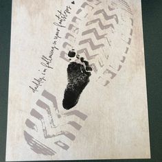 a piece of paper with a hand and foot print on it