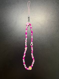 Beaded phone lanyard! Pink Takes over the colors on this lanyard, included Cute clay beads, And Pink evil eyes!  PLEASE NOTICE**  (2 are in stock, The Other Is the same color, just different Clay beads! they are randomly picked before being shipped Handmade Pink Beaded Lanyards, Beta Club, Beaded Phone Lanyard, Lanyard Pink, Evil Eyes, Phone Lanyard, Pink Clay, Cute Clay, Clay Beads