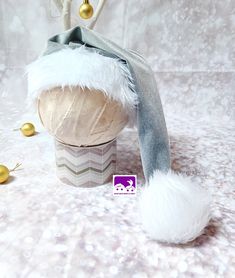 ALL HATS ARE MADE TO ORDER ON A 3 TO 5 BUSINESS DAY TURNAROUND PRIOR TO SHIPPING ... Gorgeous Santa Hat for use in baby photography,  creating cute Christmas memories! Lush soft velvet in a Silver Grey colour with White Faux Fur trim and large pom-pom.. EXTRA LONG Pull on sleepy hat style with oversized pom-pom.. Sizes available are : Head circumference Newborn : fits up to 39cm 0/3 mths : fits up to 42cm 3/6 mths : fits up to 45cm 6/12 mths : fits up to 48cm 12/24 mths : fits up to 50cm 3-5 Yea Baby Santa Hat, Baby Santa, Hat Photo, Christmas Santa Hat, Christmas Memory, Santa Baby, White Faux Fur, Grey Velvet, Baby Hat