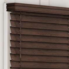 a close up of a window with wooden blinds