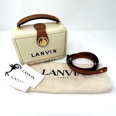 Lanvin Bento Minaudire Box Bag W/ Crossbody Strap. Nwt . This Specific Colorway Is A Hard To Find Style. Can Be Worn As Shoulder Bag With Extra Strap Or As A Top Handle For More Formal Look. Comes With Tags And Dustbag. Did Not Come With Box White Top Handle Box Bag With Original Box, Designer Beige Box Bag With Detachable Strap, Designer Beige Box Bag With Gold-tone Hardware, Beige Rectangular Box Bag With Detachable Handle, Cream Box Bag, Luxury Cream Box Bag, Luxury Cream Box Bag With Detachable Handle, Luxury Cream Box Bag For Travel, Lanvin Handbags