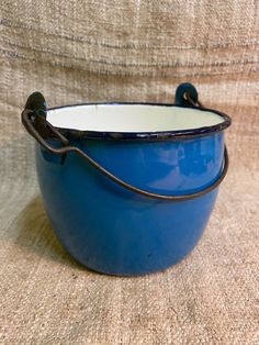 a blue bowl sitting on top of a couch