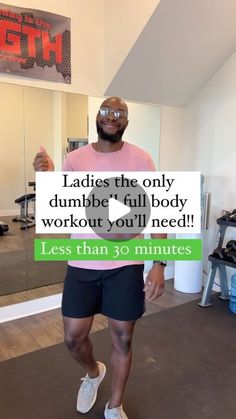 a man holding up a sign that says ladies the only dumbble full body workout you'll need less than 30 minutes