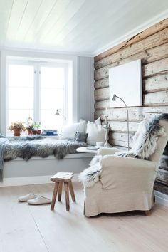 a living room filled with furniture next to a window