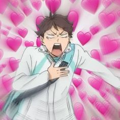 an anime character holding a cell phone in front of heart shaped pink hearts with his mouth open