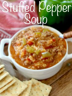 stuffed pepper soup in a white bowl with crackers