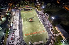 an aerial view of a football field at night