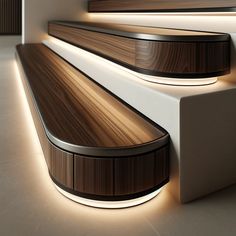 a wooden bench sitting on top of a white floor next to a wall with lights