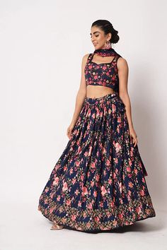 Lehenga made with Art Silk Fabric, Embellishment with a floral print and sequins embroidery work. is an indian ethnic wear that suits best to style on wedding occasion. This set features printed detail enhanced with thread, sequence and mirror work embroidery on flared lehenga paired with equally embellished choli top. The beauty part of this set is it’s sequence embroidery detailed georgette dupatta. Team up golden jewellery and stilettos with this set to have a stunning wedding look. Navy Blue Floral Print Semi-stitched Sharara For Reception, Reception Fitted Anarkali Set With Printed Motifs, Fitted Anarkali Set With Printed Motifs For Reception, Eid Festive Choli With Printed Motifs, Festive Eid Choli With Printed Motifs, Reception Lehenga With Printed Motifs Semi-stitched, Floor-length Lehenga With Printed Motifs For Wedding, Festive Sharara With Printed Motifs For Reception, Printed Motifs Sharara For Wedding And Navratri