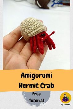 there is a small crocheted red crab in the palm of someone's hand