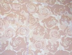 a pink and white flower pattern on fabric