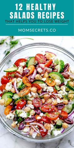 a salad with cucumbers, tomatoes, onions and feta cheese in it