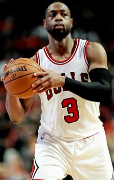 a man holding a basketball in his right hand