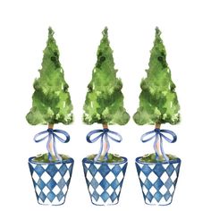 three potted trees with bows on them are shown in blue and white checkered pots