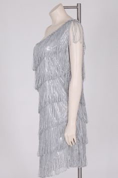 "vintage style flapper dress silver metallic fringe one shoulder style silver sequin trim asymmetric length antique reproduction size large good vintage condition, no serious flaws to note. Bust: 36\" Waist: 26\" Length: 32\" Hips: 40\" All sales are final, please ask questions before purchasing." Wedding Art Deco, Art Deco Party, Vintage Tuxedo, 1920s Style, Fur Hood Coat, 1970s Dresses, Dress Sequin, Dress Silver, Fringe Jacket