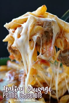 a fork full of pasta with meat and cheese