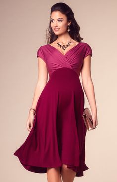 Seasonally on trend in rich red and pink in the softest premium jersey – our Alessandra maternity party dress is a great wardrobe staple for the festivities. You’ll adore the flattering cross over bodice to the front, the two way straps that can be worn on or off the shoulders and the sexy deep V to the back of the dress. With a nod to the colour block trend in rich wine red and dusky pink combined, the warm berry reds are so easy to wear and flattering. Our party dress looks amazing with diamon Maternity Christmas Dress, Maternity Holiday Dress, Pregnant Party Dress, Gaun Koktail, Cocktail Dress Maternity, Tiffany Rose, Dresses For Pregnant Women, Pregnant Wedding, Pregnant Wedding Dress