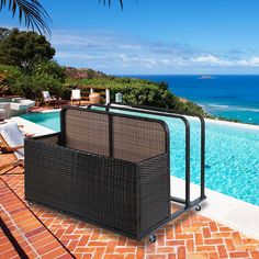 an outdoor swimming pool next to the ocean