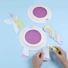 someone is making paper plates with unicorns on them