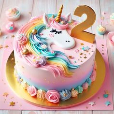 there is a unicorn cake on the table