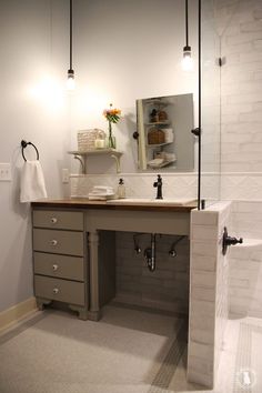 a bathroom with a sink and mirror in it