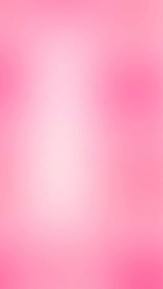 a blurry red heart on a pink background