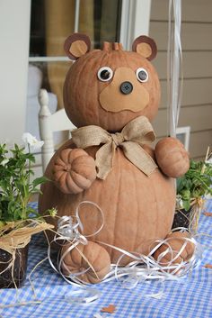 a stuffed bear sitting on top of a table