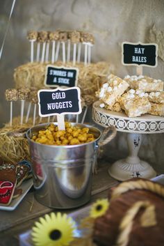 a table topped with lots of food and desserts