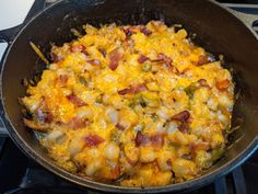 a pan filled with food sitting on top of a stove