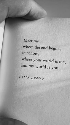 someone is holding an open book with the words meet me where the end begins in ecchoes, where your world is me, and my world is you