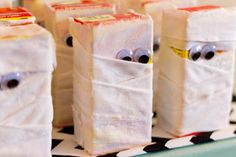 some white bags with faces and eyes on them