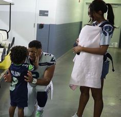 a man and two young children standing next to each other