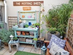 an outdoor potting shed with pots and plants