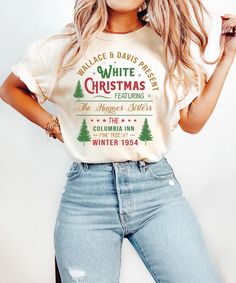 White Christmas Movie Shirt - A Touch of Holiday Magic Celebrate the joy of the holiday season with our "White Christmas Movie" shirt! Inspired by the classic film, this shirt features a charming design that captures the spirit of Christmas nostalgia. Made from soft, breathable fabric, it's perfect for holiday parties, cozy movie nights, or casual outings with family and friends. Share the magic of Christmas and make lasting memories while wearing this delightful shirt that adds a festive touch to your wardrobe! Product features - Made with 100% sustainable US cotton - Twill tape shoulder tape for stability - Ribbed knit collar for elasticity - No side seams for reduced fabric waste - Oeko-Tex certified for safety and quality assurance Care instructions - Machine wash: warm (max 40C or 105 White Festive Holiday T-shirt, Cheap White Christmas T-shirt, Hallmark Christmas Movie Shirt, White Christmas Festive T-shirt, White Christmas Movie, Tape Shoulder, Christmas Movie Shirts, Christmas Nostalgia, White Christmas Character Print T-shirt