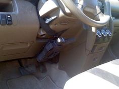 the interior of a car with a steering wheel and dash stick attached to the dashboard