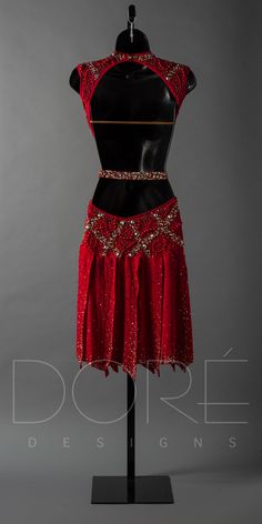 a mannequin wearing a red dress with sequins on the skirt and top