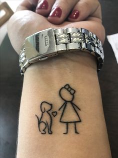 a woman's arm with a tattoo of a girl and her dog on it