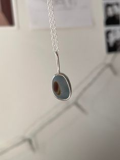 Handmade sterling silver Sea Glass necklace, made with recycled silver, and genuine Sea Glass from the Jurassic Coast. This necklace has one rare piece of multi blue and brown  Sea Glass, and is very dainty and elegant.  This necklace is a perfect gift for a special occasion, and is perfect for Sea Glass lovers! The chain is 18" (45cm), and has an easy closure. All of the silver on the necklace is 925 Sterling Silver, including the chain and small jump rings! Feel free to message me for any additional information, or for commissions/custom requests! Everyday Silver Glass Jewelry, Minimalist Silver Glass Necklaces, Brown Sea, Chain Jewellery, Jurassic Coast, Silver Sea, Jewellery Gifts, Sea Glass Necklace, Recycled Silver