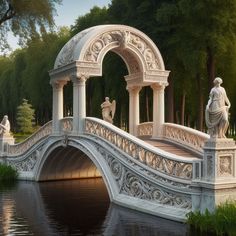 a bridge with statues on it over a body of water