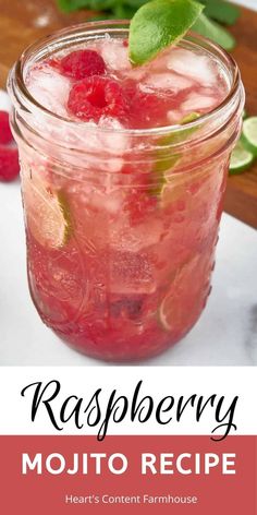 a mason jar filled with raspberry mojitos